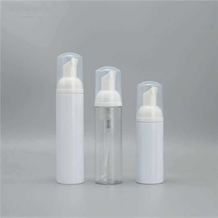 Three foam pump bottles in white and transparent designs with caps.