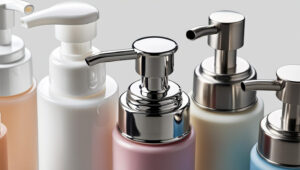 Assorted lotion and soap pump bottles with plastic and metal tops.